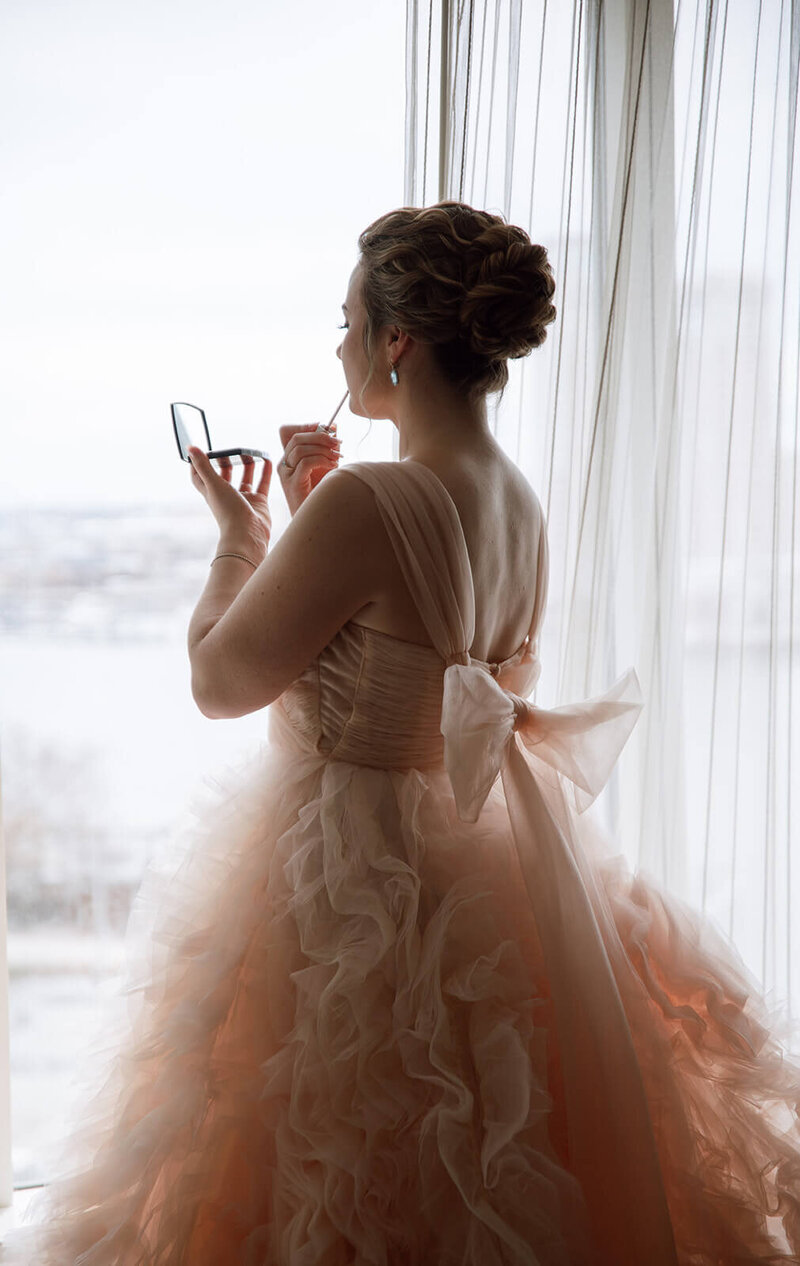 Bride with curls styled into a tight, elegant updo — a romantic, fairytale-inspired bridal hairstyle by Klover Beauty for a Maryland wedding.