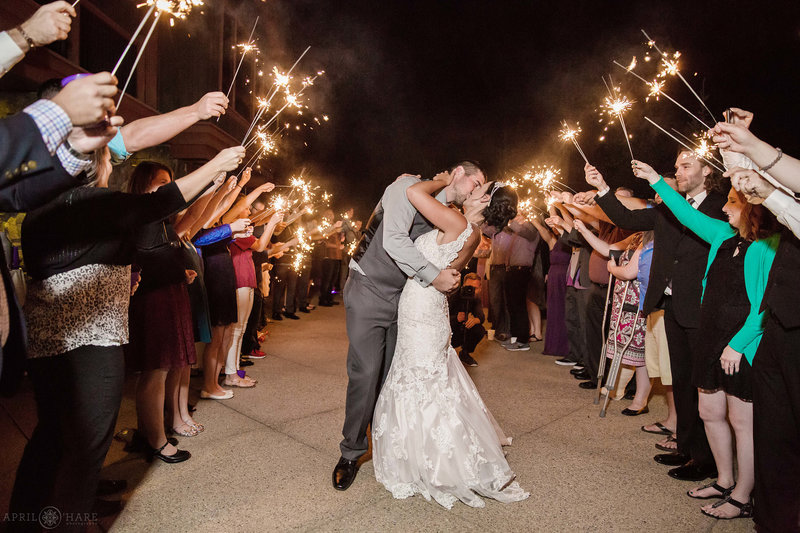 Couple kisses with sparklers at BlueSky Breckenridge