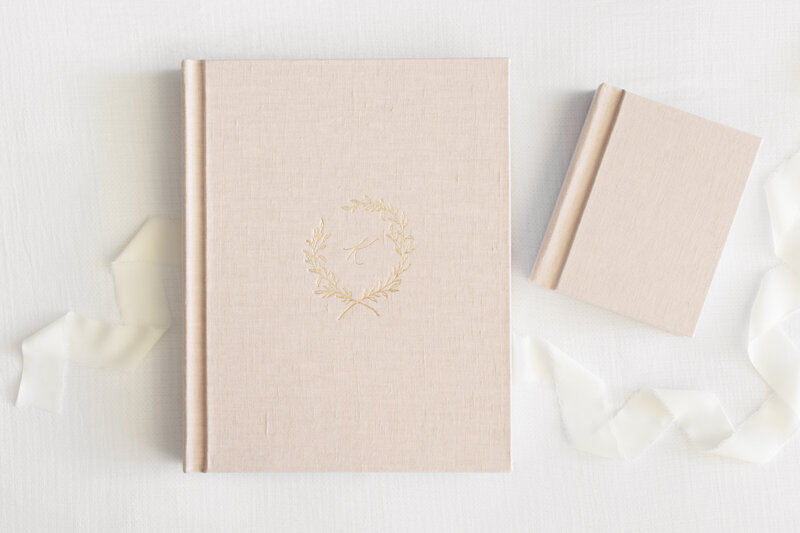 A large pink heirloom album with gold debossing by Newborn Photographer Washington DC