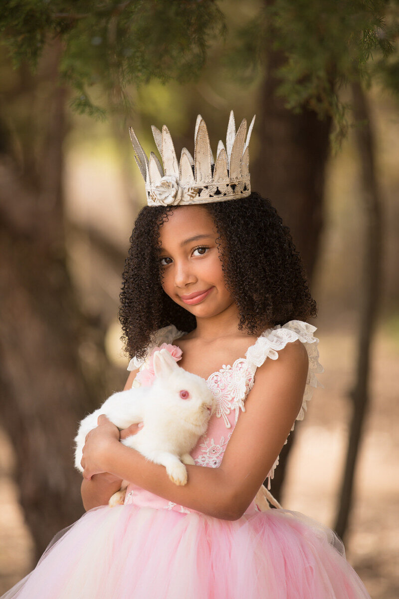 girl-holding-white-bunny-in-pink-couture-dress-and-white-crown-in-arlington-tx