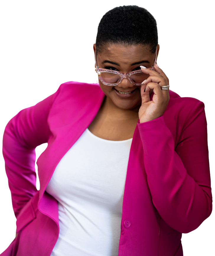 Professional career change coaching expert wearing a pink branded blazer and reading glasses, providing personalized guidance.