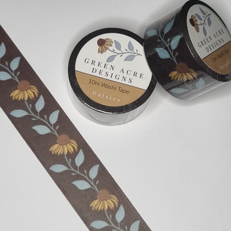 Inspired by the natural beauty of trailing daisies and echinacea blooms, this rich burgundy washi tape adds warmth and floral elegance to your creative projects. Perfect for journaling, gift wrapping, scrapbooking, or adding a touch of botanical charm to your planner, the hand-illustrated design features flowing florals in a deep, earthy palette. A beautiful addition for lovers of refined stationery and floral design.