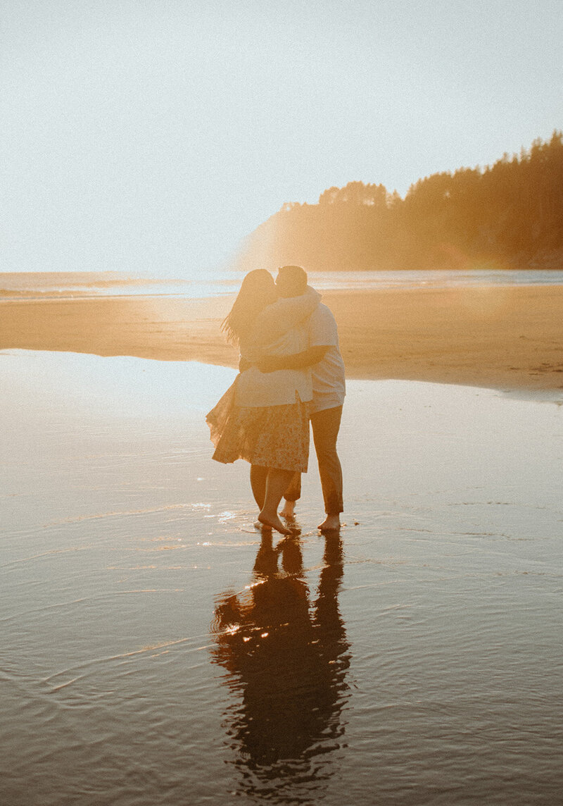 couple hugging at sunset on the beach
