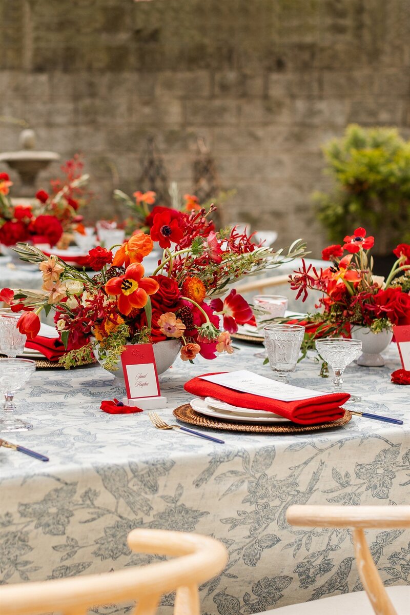 Wedding rings, floral details, and invitation suite at the Blackstone Hotel, lplanned by Chicago wedding planner Savoir Fête. The setup exudes elegance and sophistication.