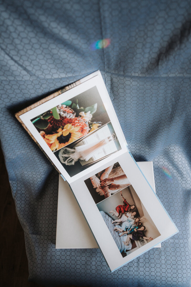An open wedding album to showcase the images inside.