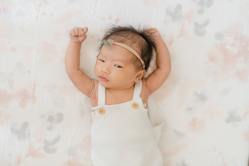 baby stretching during Vienna, Virginia newborn session