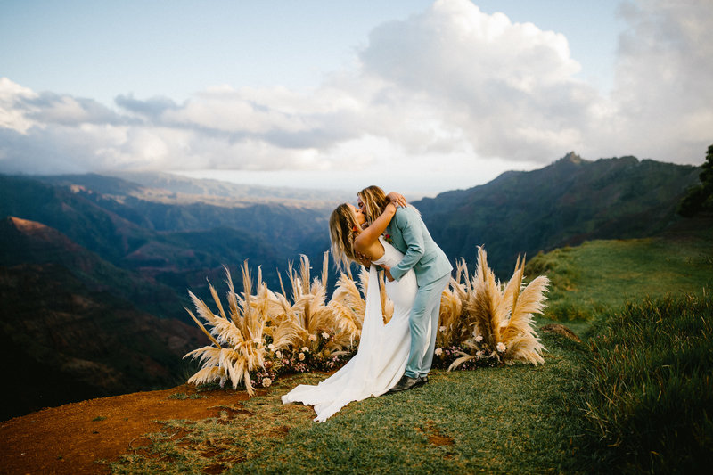 Bride and groom share a kiss as they elope in Waimea Canyon