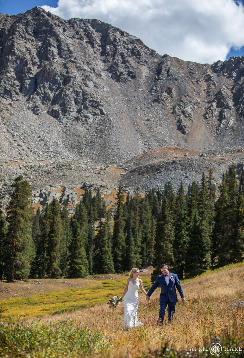 Dramatic couples portrait on a fall wedding day at A Basin Ski Resort