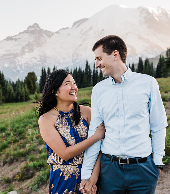 A couple strolls together through Mt Rainier National Park during their adventure session with outdoor elopement photographer amy galbraith