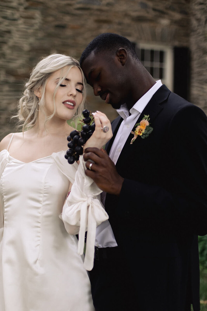 Bride with an elegant, romantic low updo featuring soft braids — timeless bridal hairstyle created by Klover Beauty for a Maryland wedding.