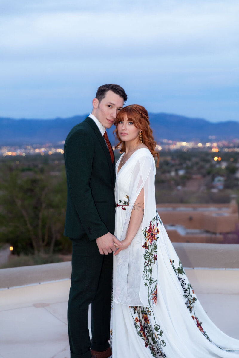 Couple sharing an intimate moment during their blue hour elopement in Utah, photographed by Lamblight Photography
