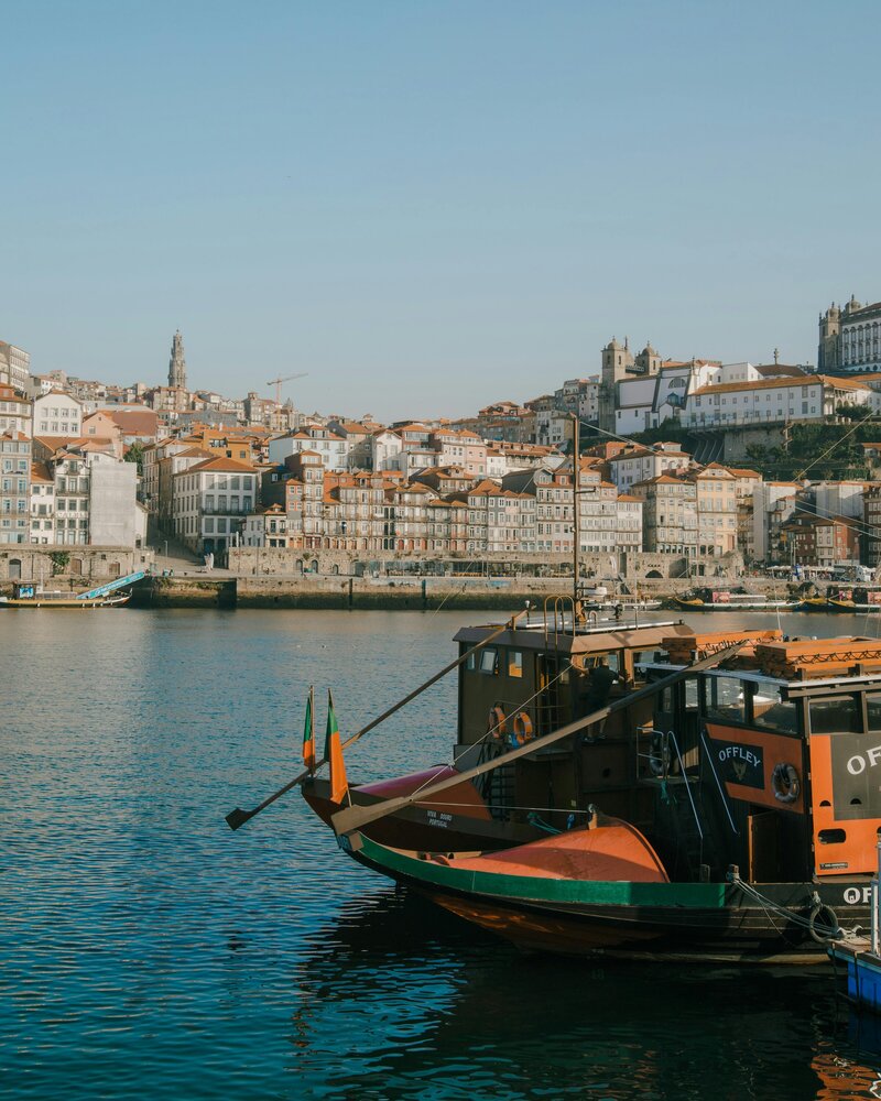 Boats docked in Porto, Portugal—a nod to slow travel and savoring place, part of the Leaving Main Street philosophy.