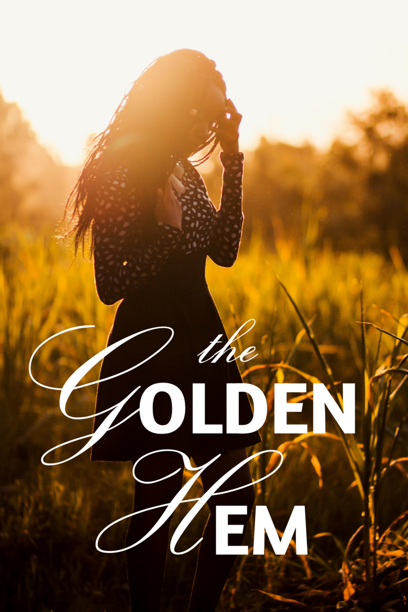 lifestyle mockup of woman in a picturesque meadow with the logo The Golden Hem