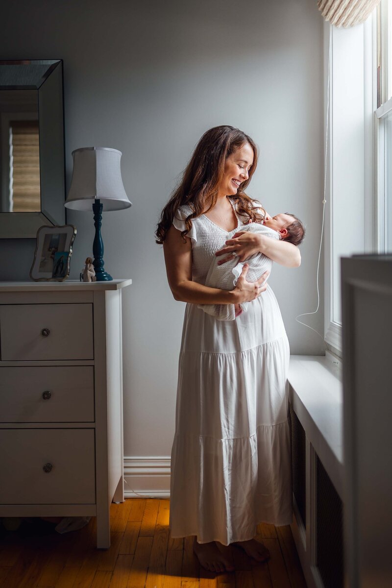 son hugging moms leg long island family photo session