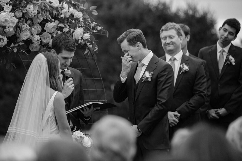 Groom cries tears of joy during wedding reception at the Crane Estate.