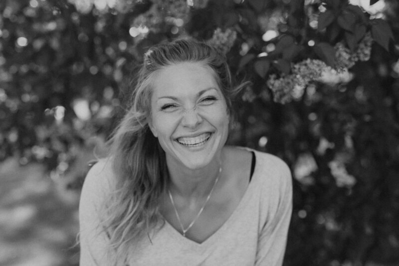 Portrait of a woman laughing and lookin to the camera in Helsinki in Finland