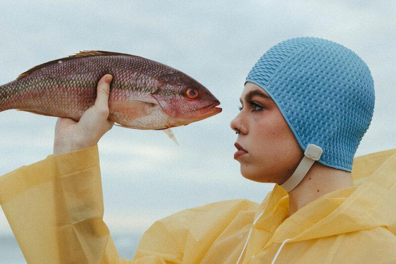 woman holding a fish