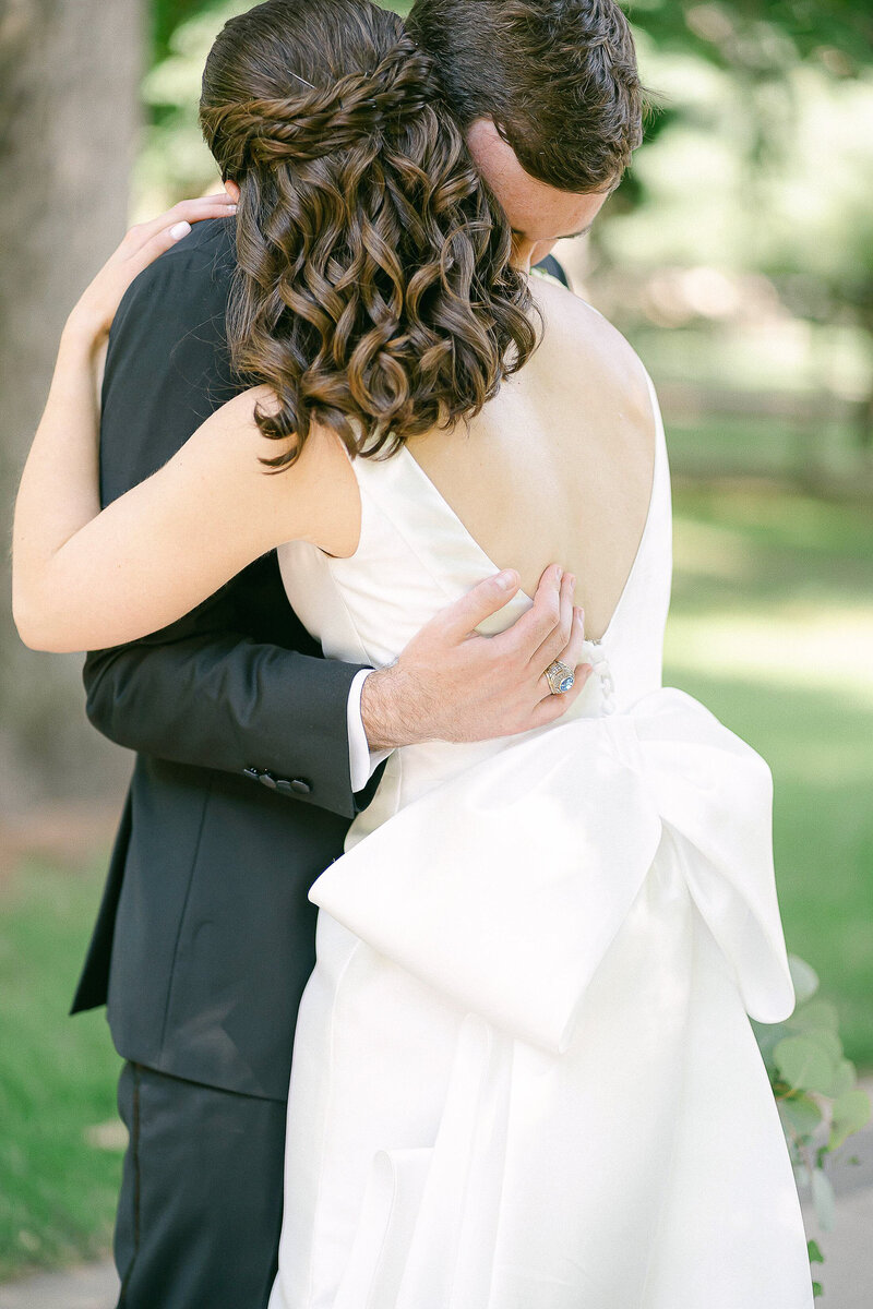Bride and Groom embracing during their portrait session on their wedding day
