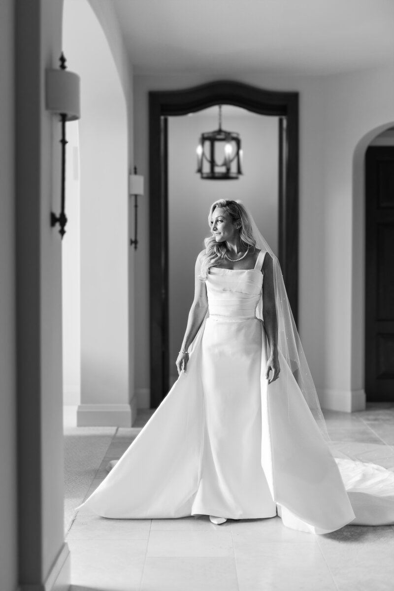 Bride walking through beautiful estate at her small intimate wedding.