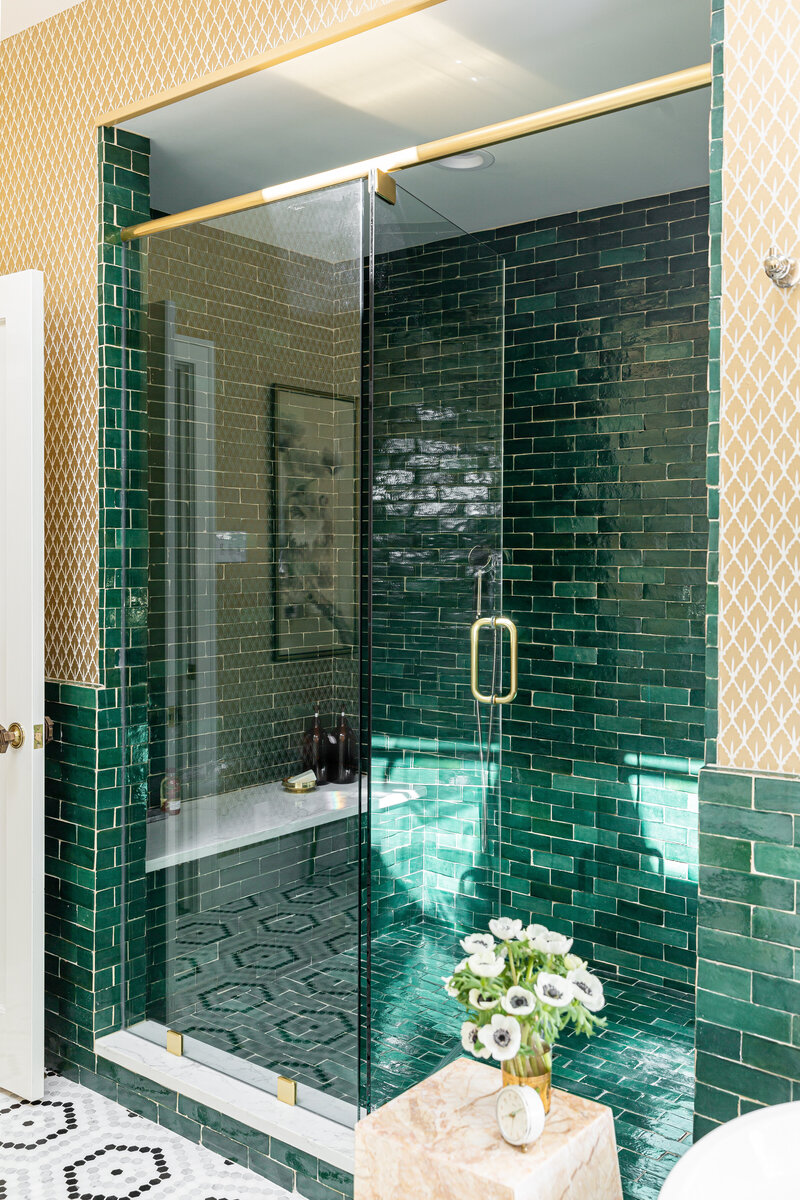 Small space bathroom with black farmhouse wall sink, and black grid shower screen