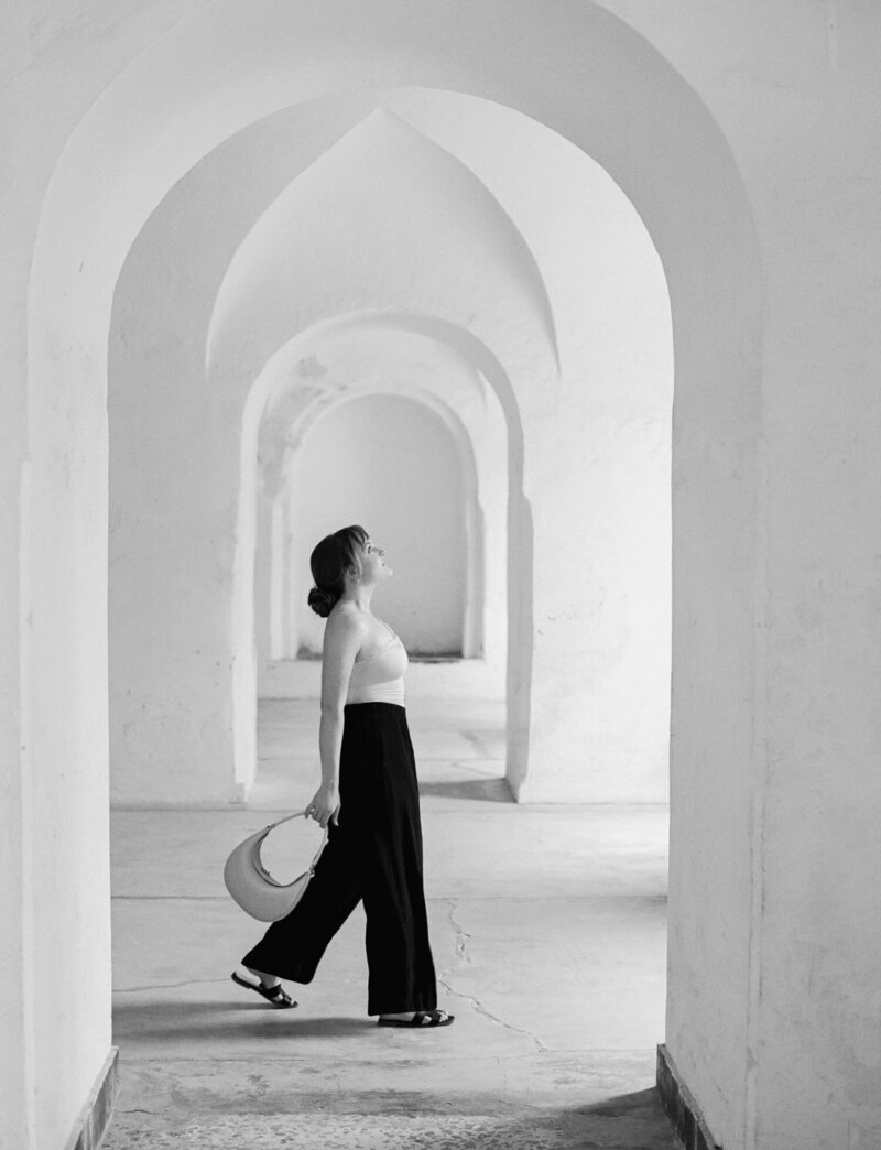 michigan & destination film brand photographer in Caribbean, Old San Juan, Castillo San Cristobal white arches