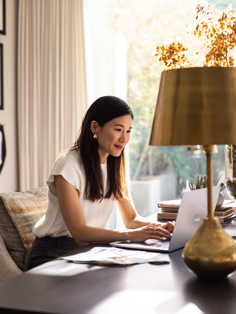 krista5123_modern_asian_woman_at_home_office_desk_laptop_open_f25c8670-a4cf-4095-9c52-f2270aebadf3_3