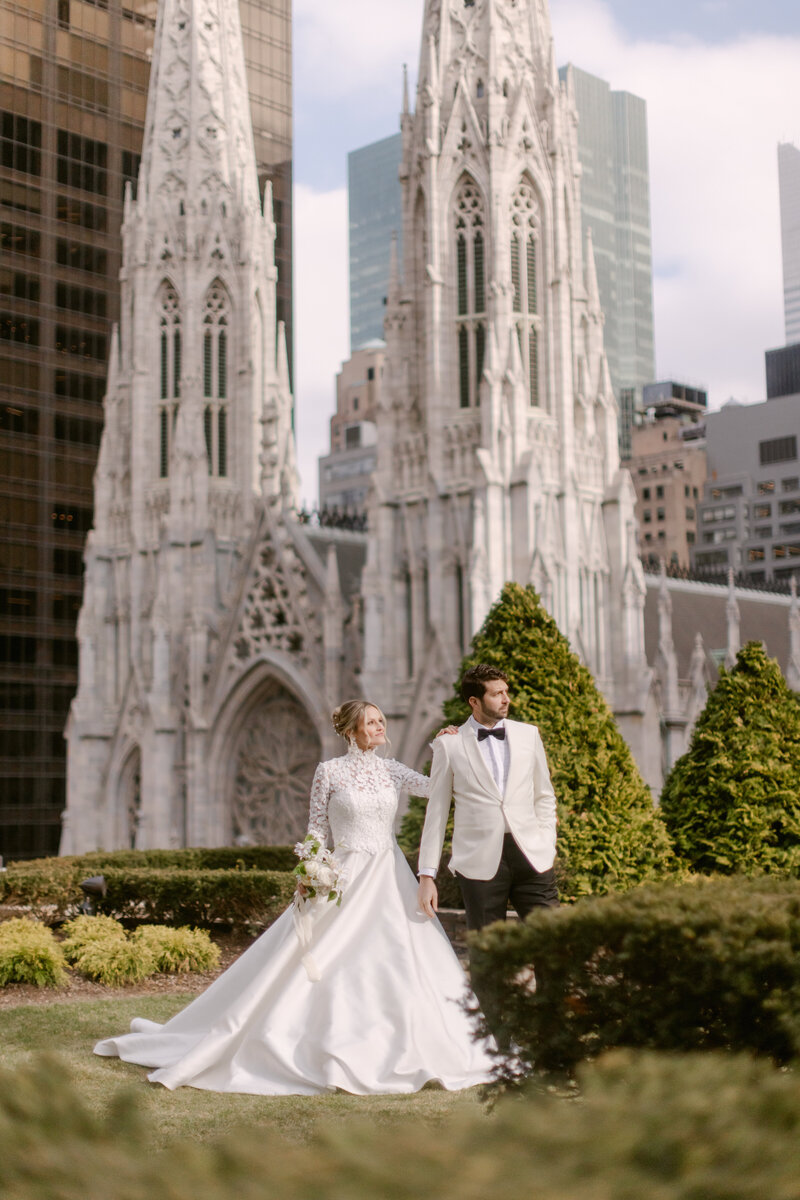 Bride and groom standing on a rooftop in New York