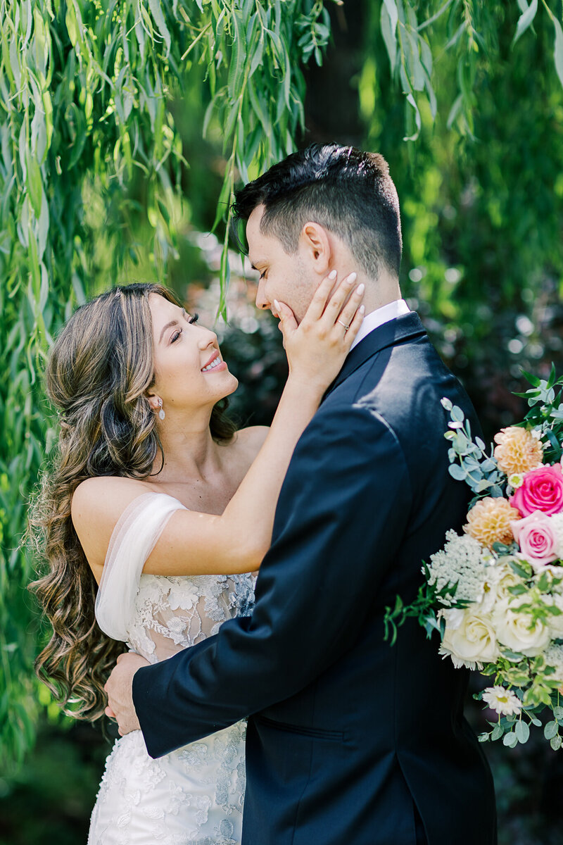 Rustic wedding ceremony at White Ranch in Chico, California, featuring a bride and groom with scenic countryside views, golden fields, and charming rustic architecture.