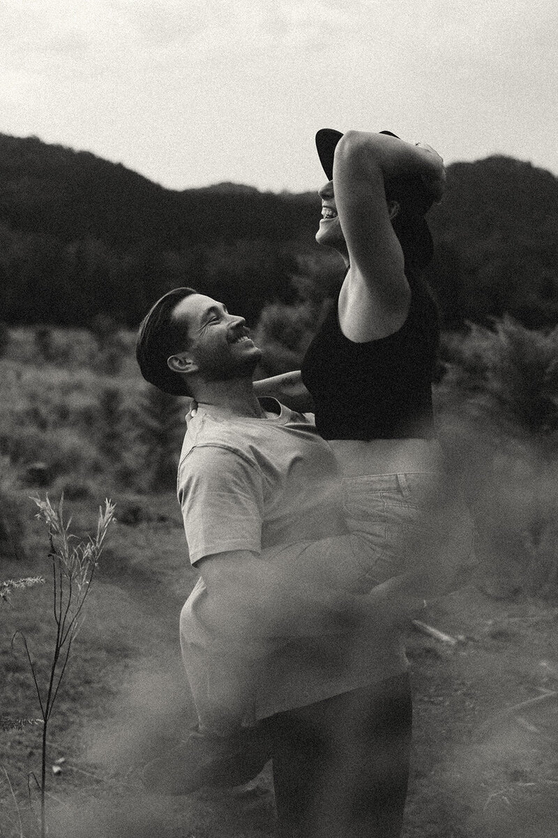 black and white image of a couple eloping in picturesque landscape by Elopement photographer