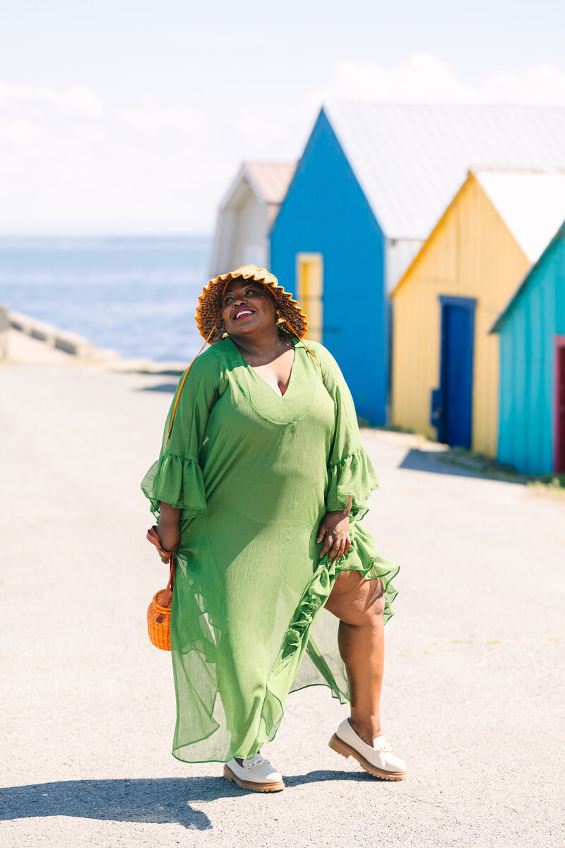 A portrait of Milaine at her fashion branding photography session, posing at the Wharf