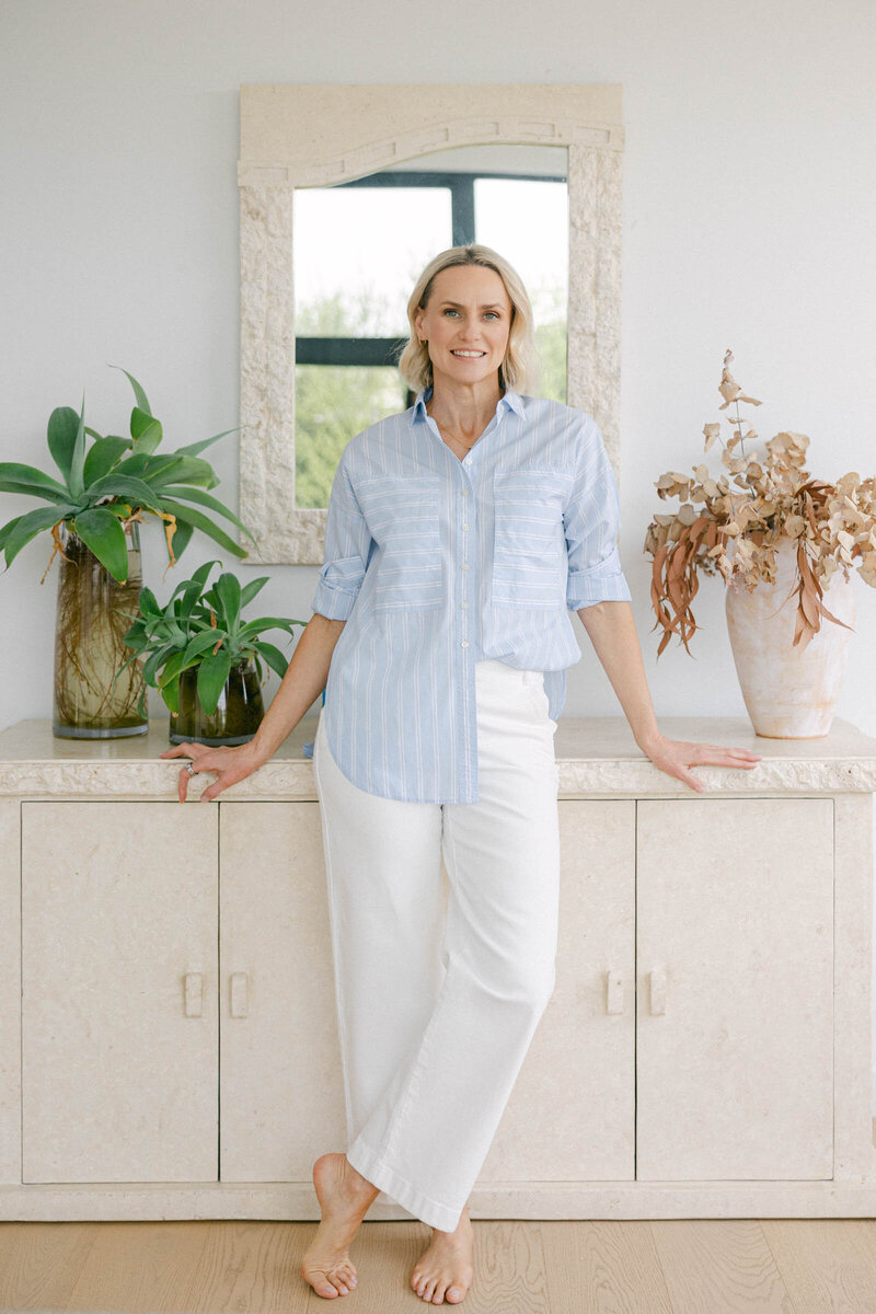 Zelda Green, professional photographer turned money and mindset educator, smiling at camera looking happy and relaxed