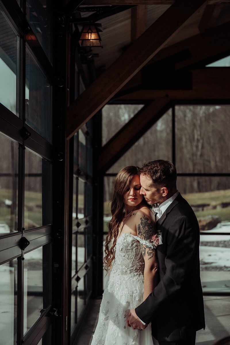 Bride and Groom wearing Marquise Formal Wedding wear Chautauqua NY Bridal shop