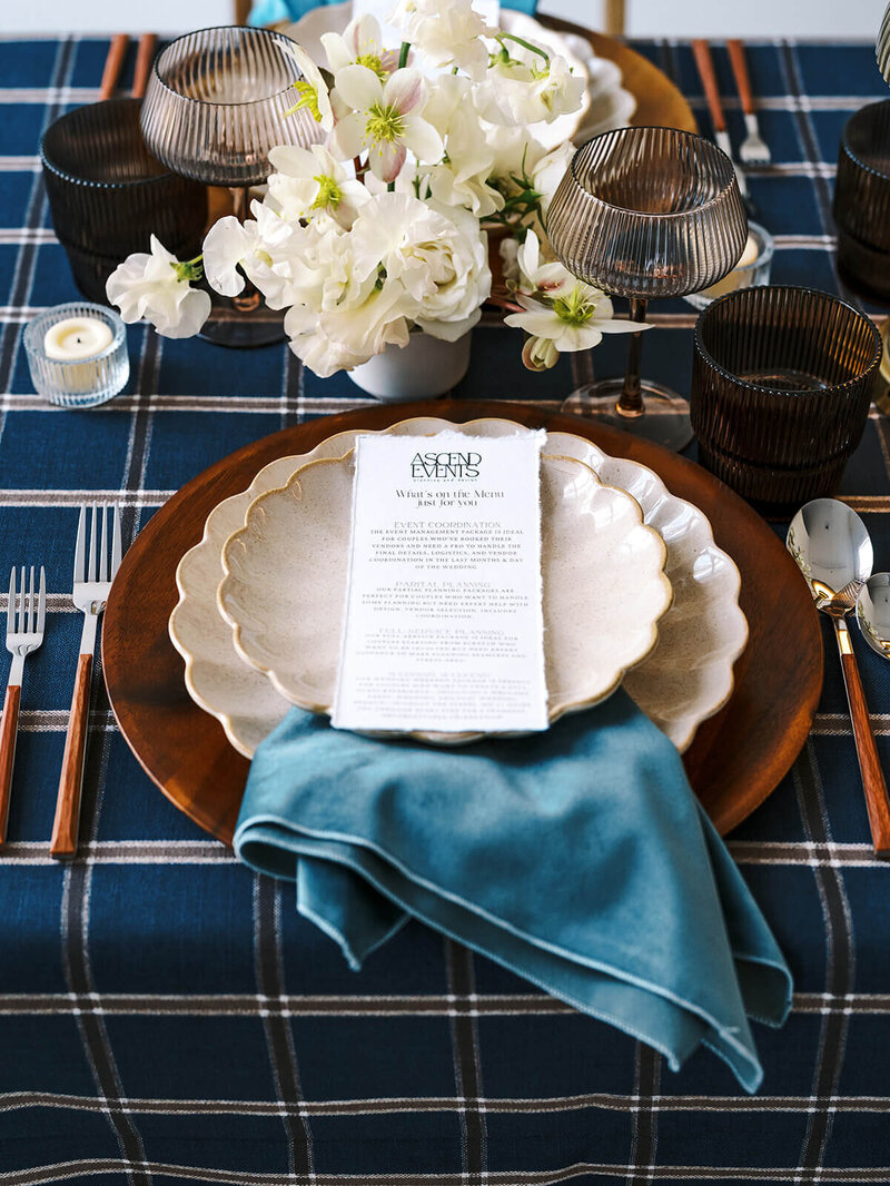 A tablescape with flowers, place settings, and linens, representing a styled photoshoot by Among the Oaks and Ascend Events. 