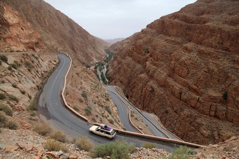 Light Shifter Studios takes photos of a car climbing a mountain top in Morocco. 