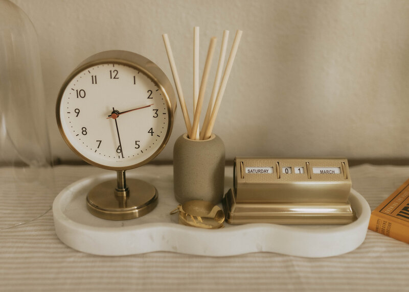 Gold clock and office supplies