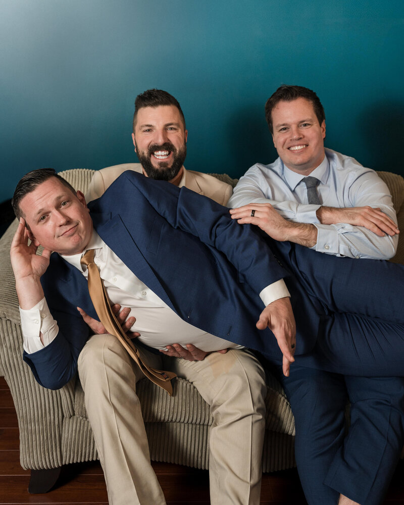 men in suits laughing