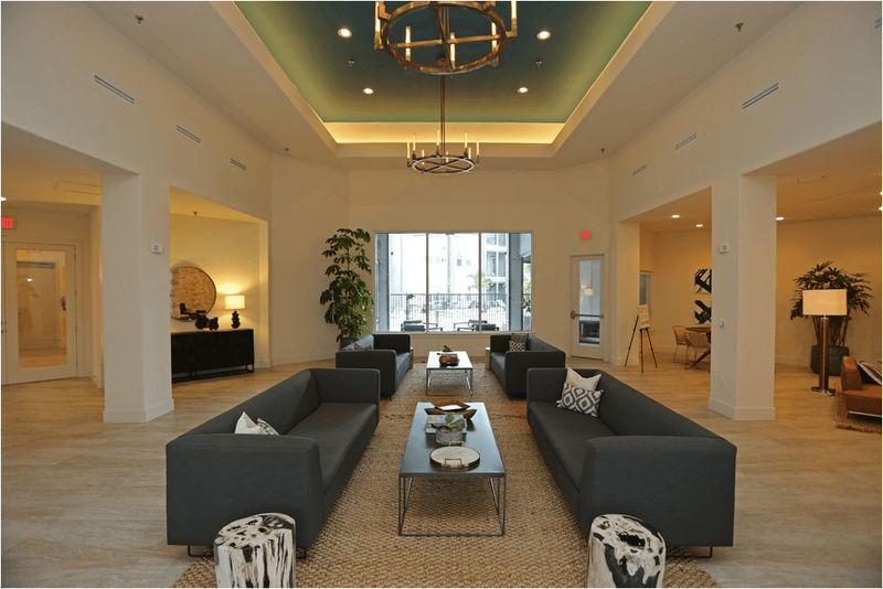 Interior lobby at Mirabella Apartments in McAllen Texas, showcasing the modern design and premium resident amenities maintained through WLS Interests property management services.