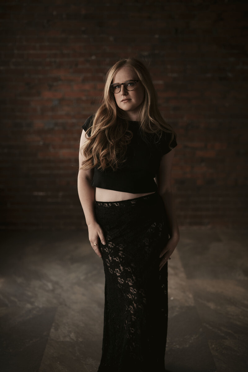 Empowered Portrait of Maggie, the owner and photographer behind The Delicate Studio Boudoir Photography