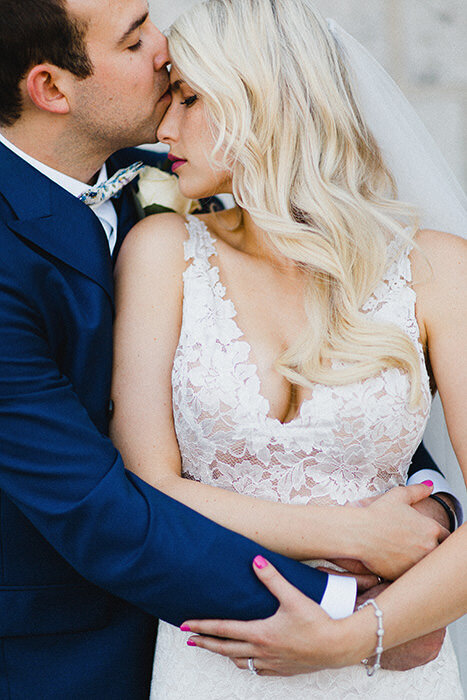 Elegant couple in Old Montreal, embracing and having an intimate moment together. 