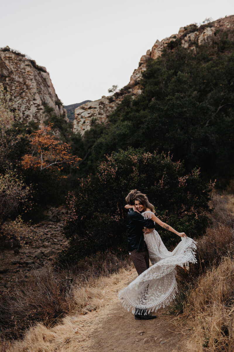 Couple during adventure elopement at Malibu Creek State Park in California