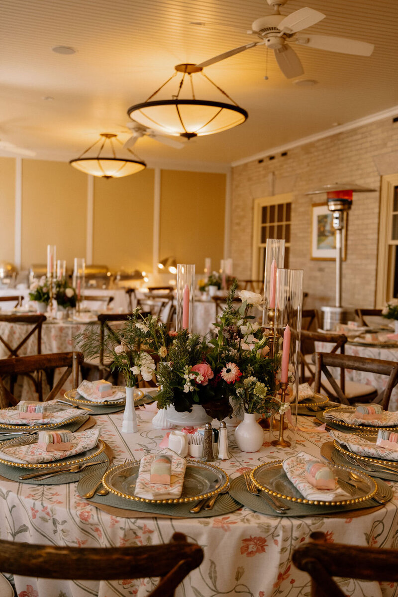 Wedding table styled with candles, place settings, and a floral centerpiece during a New York City celebration
