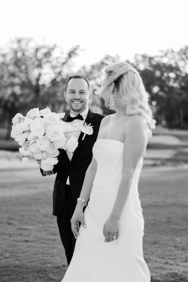 Bride and Groom Portrait on a golf course at the Country Club of Orlando by Orlando wedding photographer