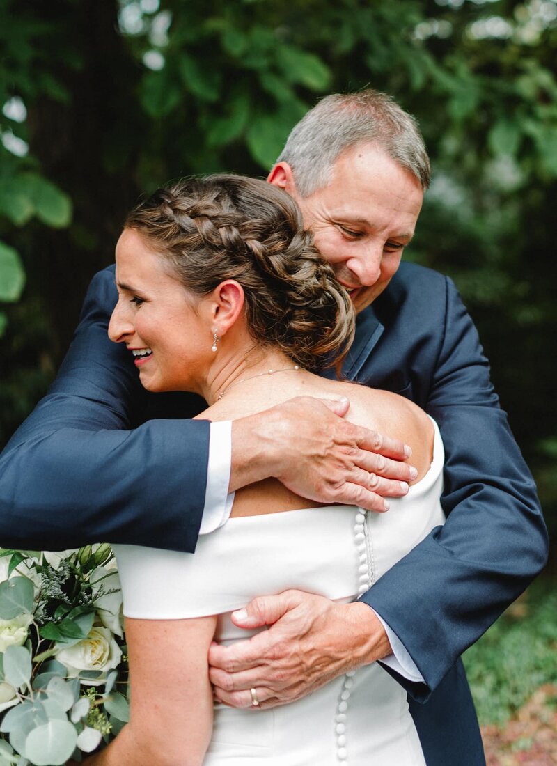 Bride and father share emotional embrace at Downtown Charlottesville wedding