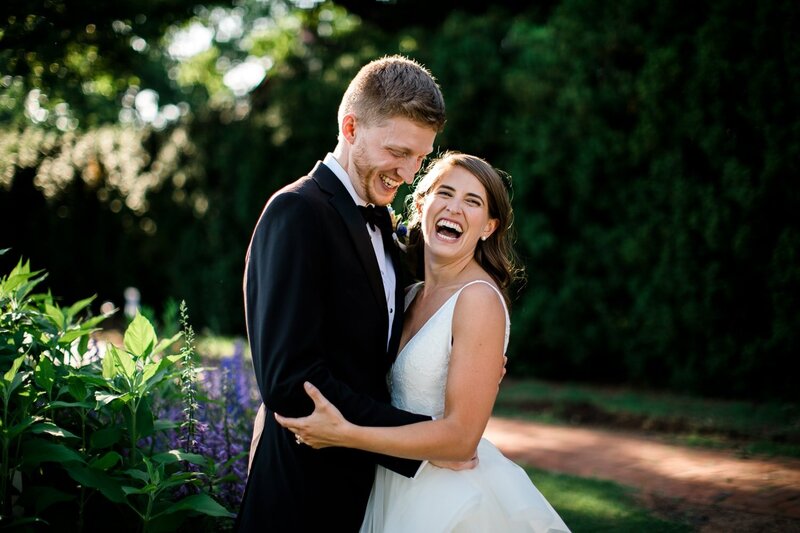 A couple laughs during wedding portraits at James Monroe's Highlands in Charlottesville