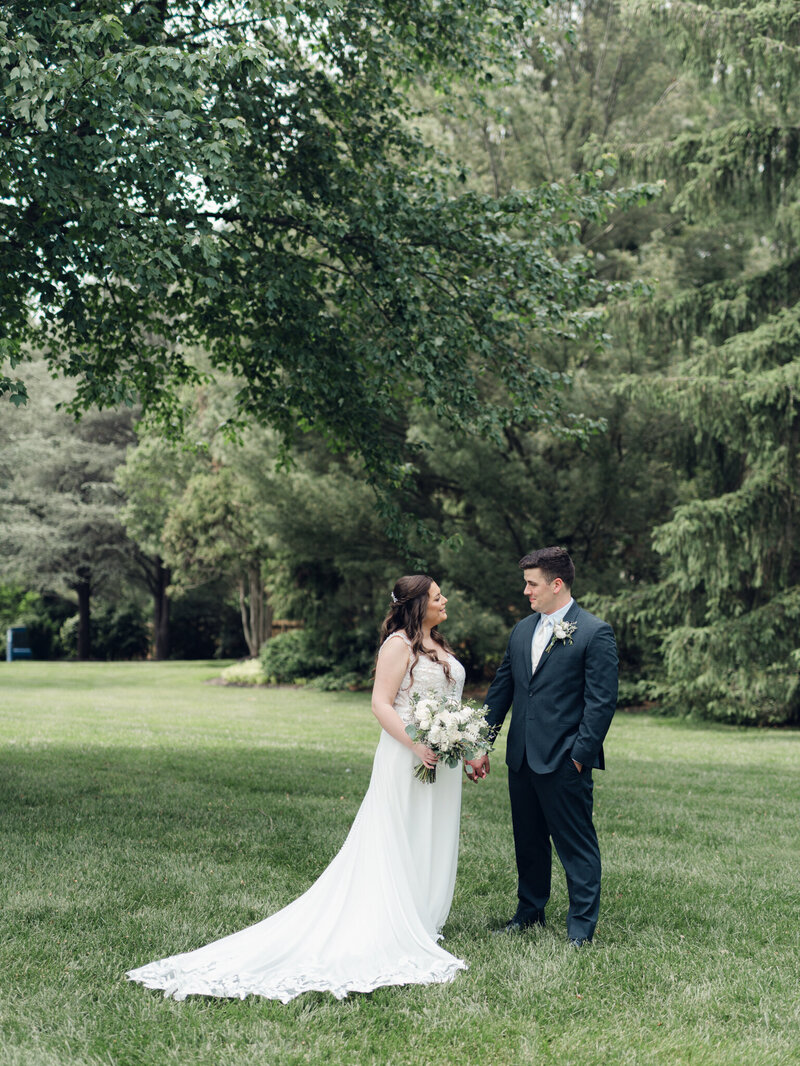 bride and groom standing with each other holding hands taken by washington dc wedding photographer Nicole Simensky
