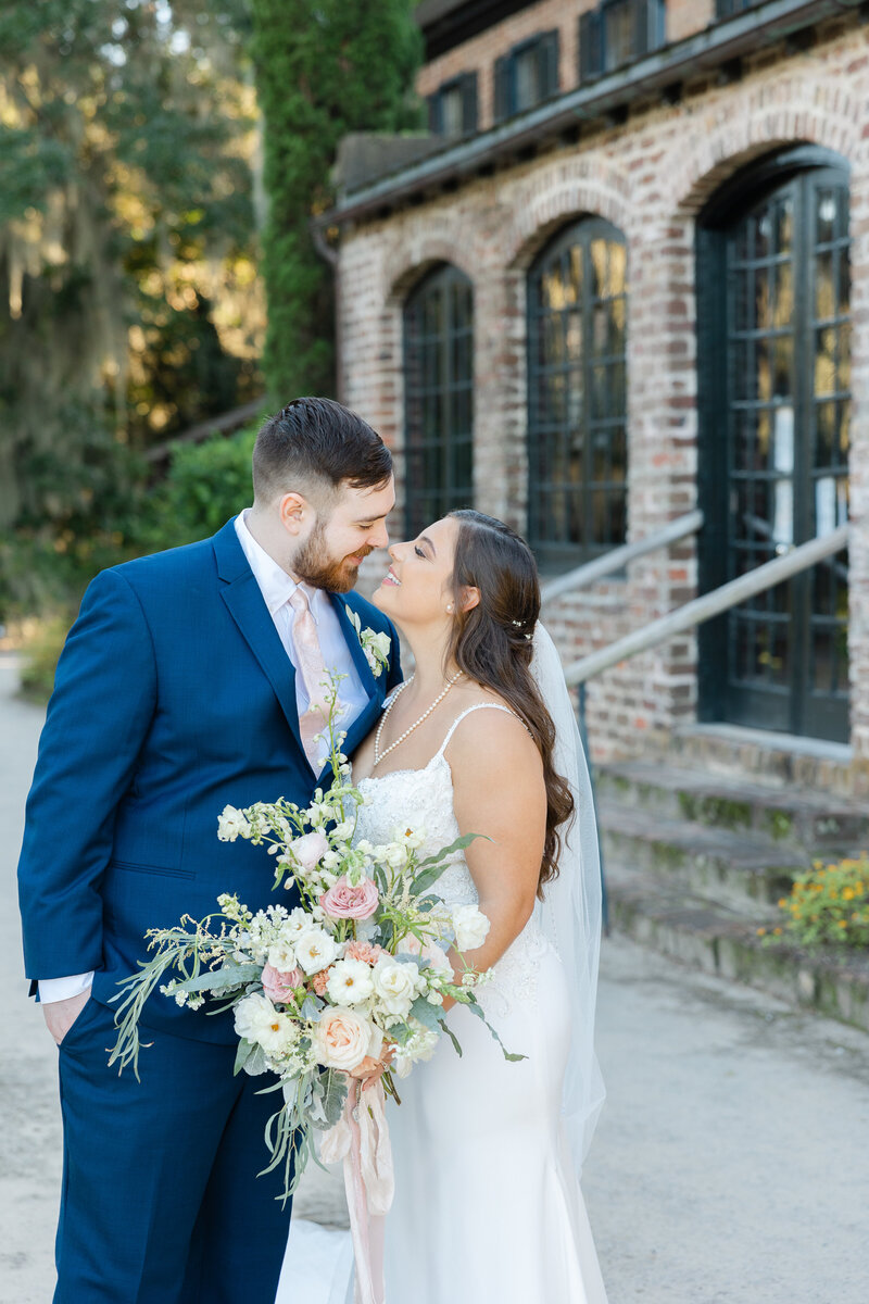 bride and groom going in for a kiss