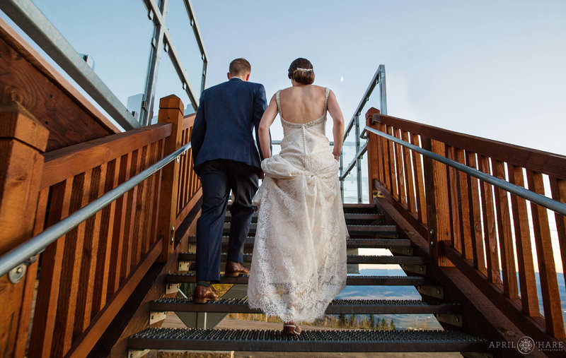 Couple walks into their wedding reception at Four Points Lodge