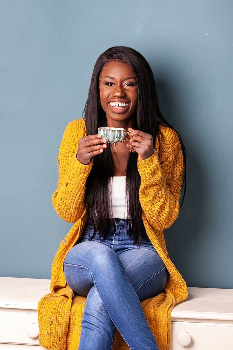 Akua Konadu - Storyteling Speaker and Event Emcee with tea cup
