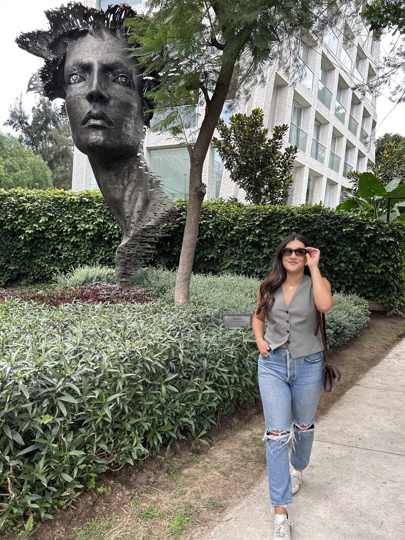 Latina web designer waling outdoors in Mexico 