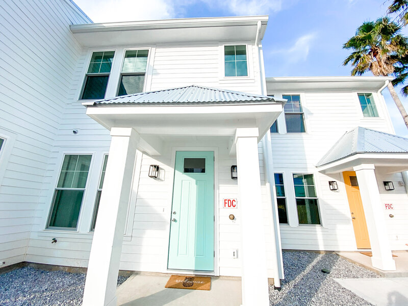 white townhouse with blue door